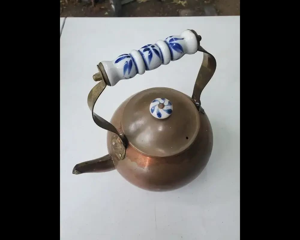 Vintage copper kettle porcelain handle
