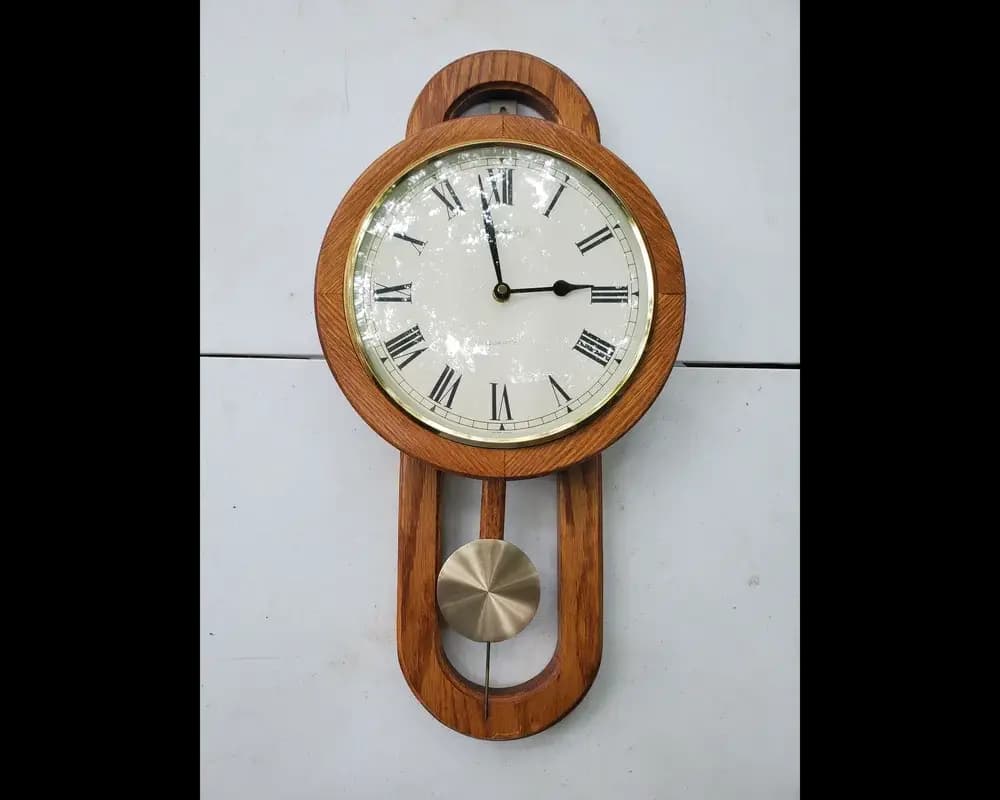 Vintage wooden quartz pendulum clock